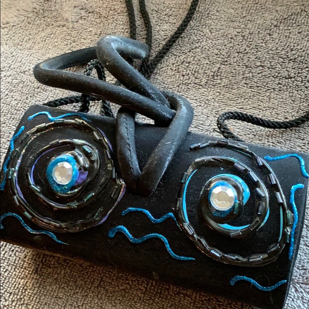 Satin evening bag cleverly decorated